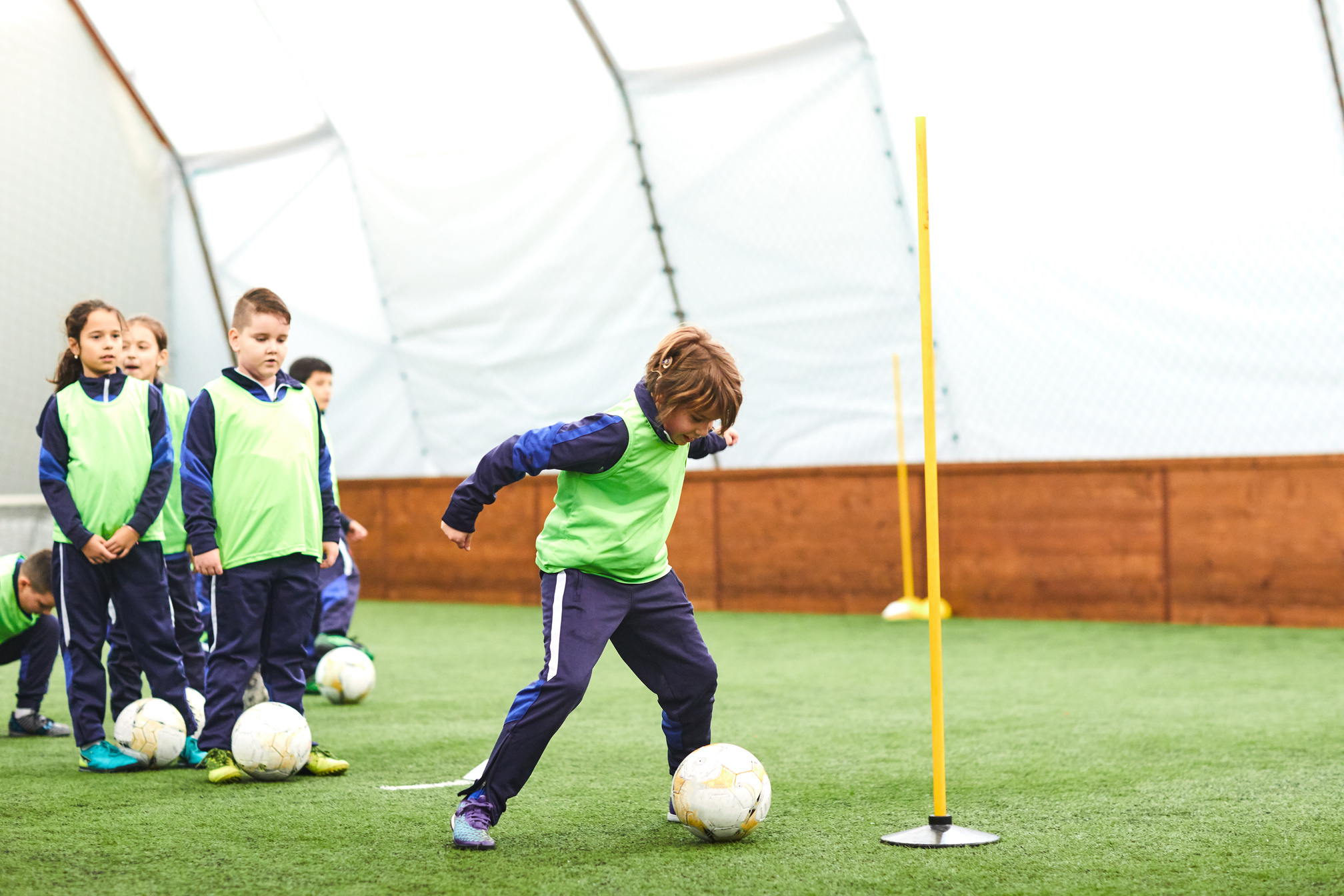 Kids Soccer Training. Indoor Soccer Players Training With Ball